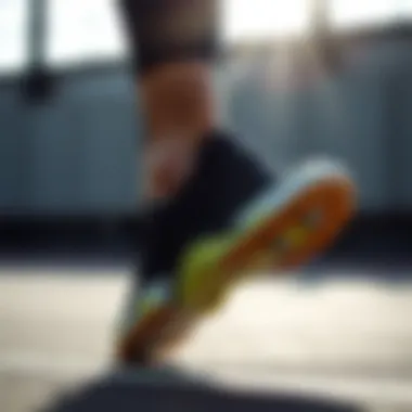 A person wearing ankle sports shoes during a workout.