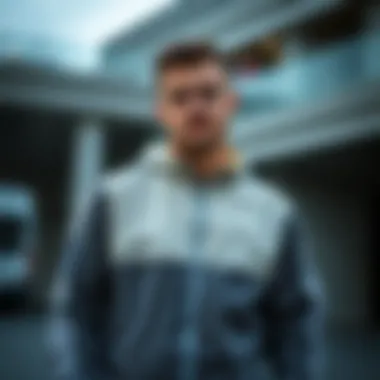 A stylishly dressed individual wearing an Adidas jacket in a casual setting.