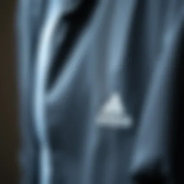 Close-up of the fabric and detailing of an Adidas jacket emphasizing quality.