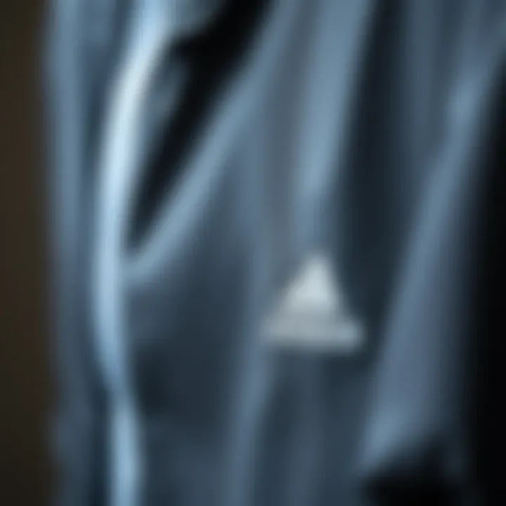 Close-up of the fabric and detailing of an Adidas jacket emphasizing quality.