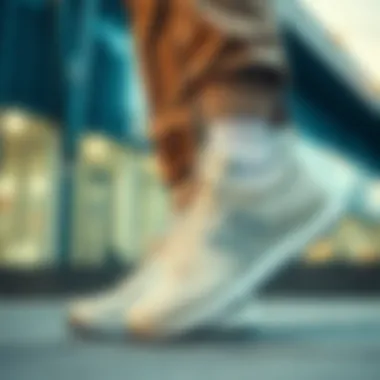 Urban Fashion with New Balance Cream Shoes A fashionably dressed individual wearing cream New Balance shoes in an urban setting.