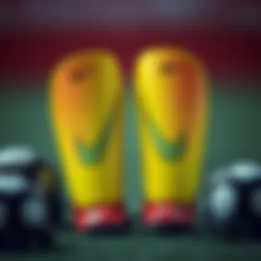 Nike children's shin guards displayed with soccer gear