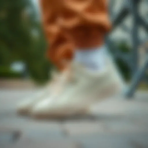 The Perfect Blend of Elegance and Sportiness Elegant beige Puma footwear paired with stylish athletic attire