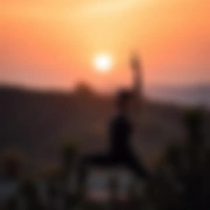 Serene Yoga Practice at Dawn Individual practicing yoga at sunrise